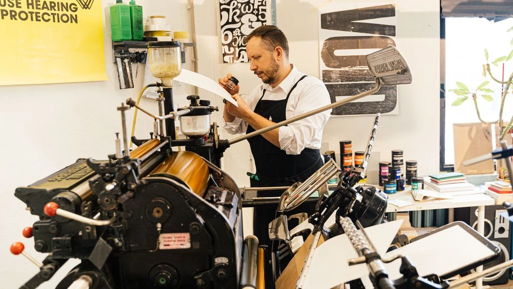 Master printers at the bench inside the Kodak Gallery production floor.